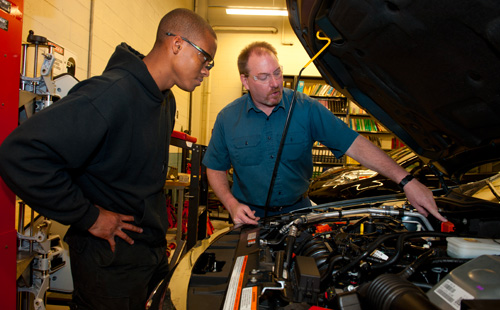 Student and instructor in Automotive Lab