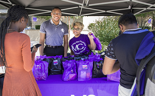 Montgomery College Student Life handing out goodie bags to students.