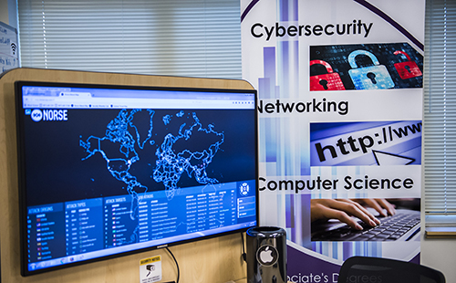 Cybersecurity banner next to display of world map with server hub locations marked.